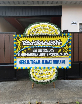 Papan Bunga Duka di Sakra Barat